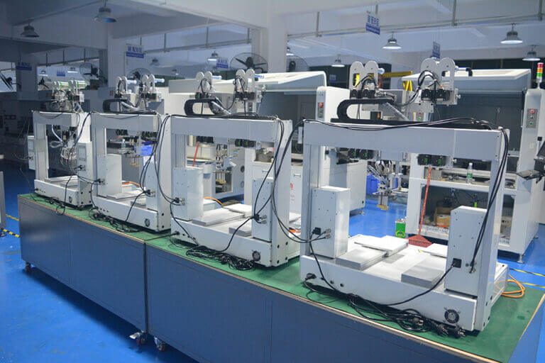 Multiple resin dispensing machines on an assembly line