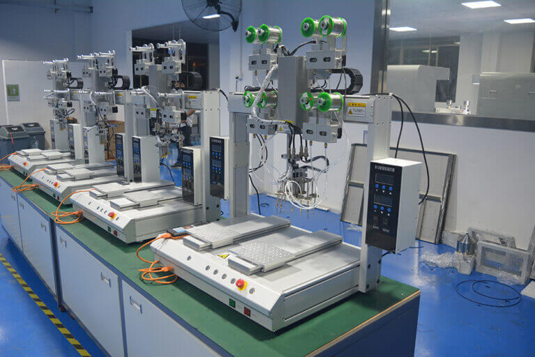 Resin dispensing equipment undergoing assembly and setup