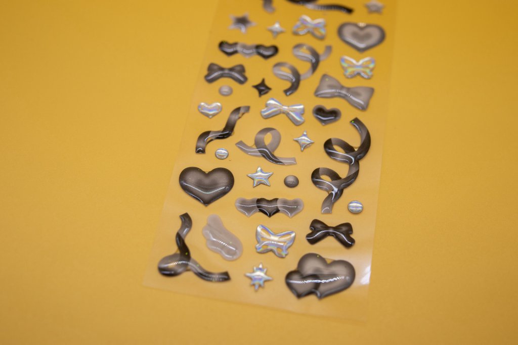 Dark decorative domed stickers with curved and pointed outlines