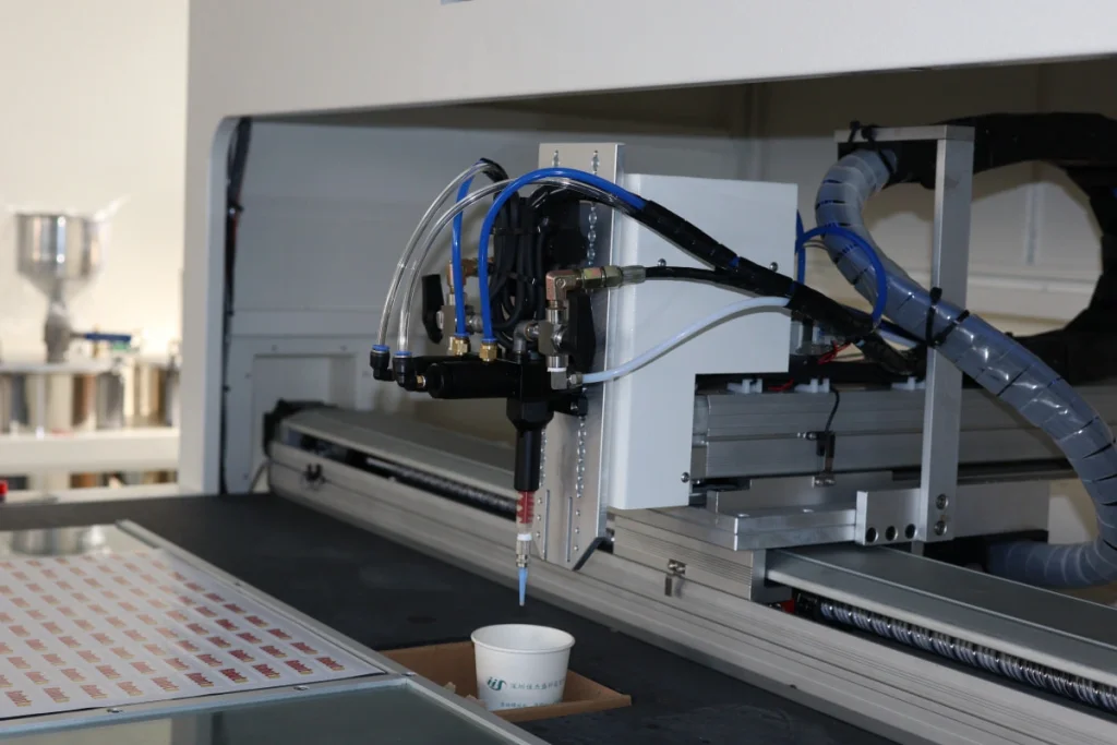 SJ4060 CCD vision dispensing head positioned over a sample sheet