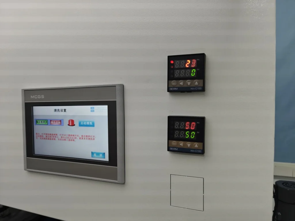 Resin Doming Production Line Setup Checklist Machine cleaning control screen and temperature controllers on a resin dispensing system