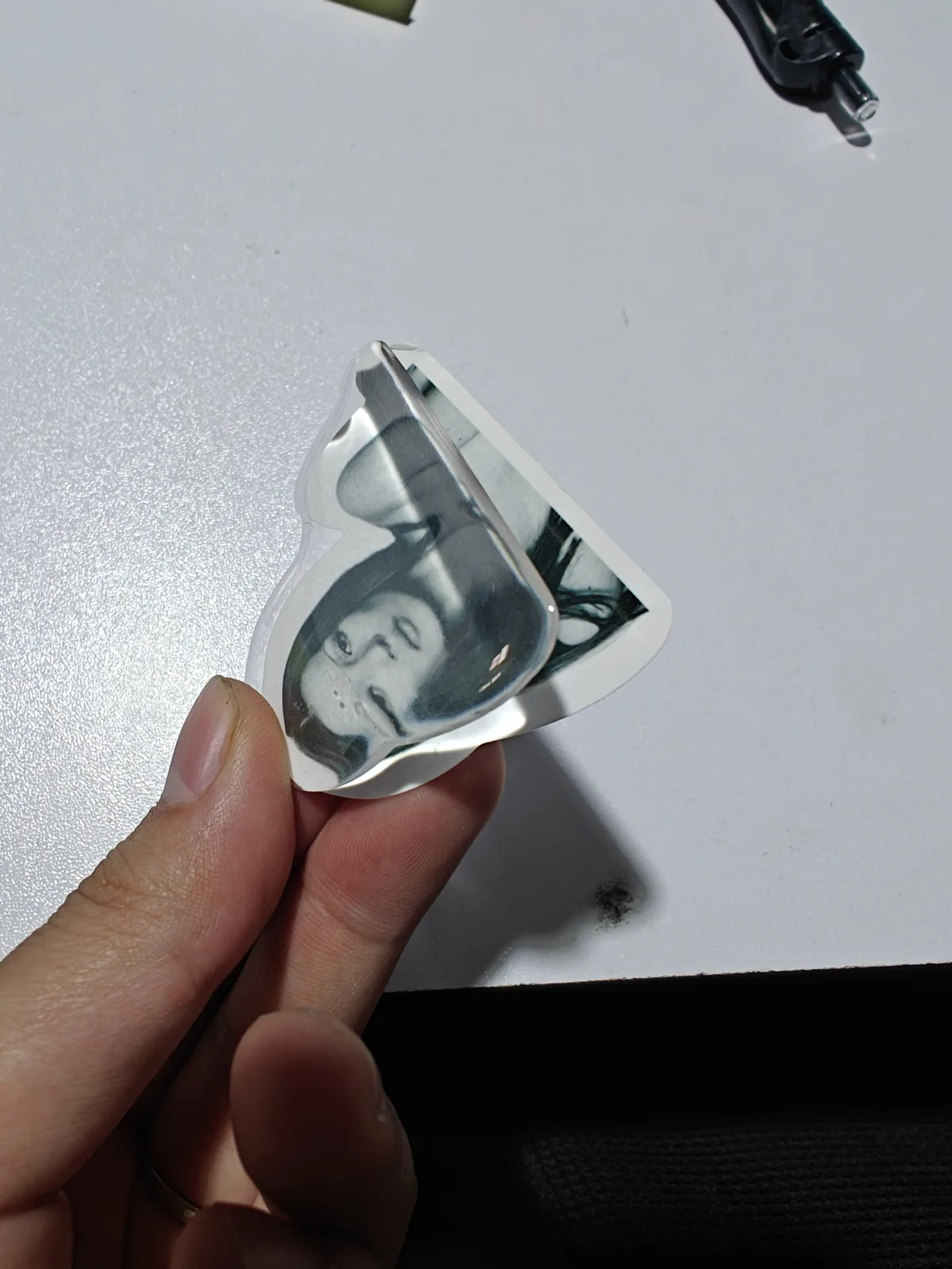 How to Prepare Printed Labels Before Resin Doming Clear cured resin layer separating from a printed label during inspection