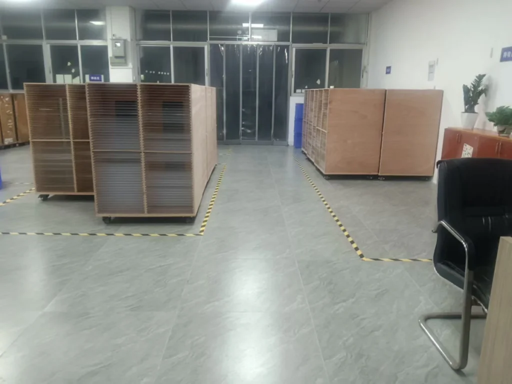 Resin Doming Production Line Setup Checklist Mobile curing racks arranged in marked floor zones at a doming factory