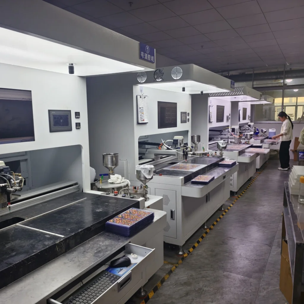 Multiple automatic resin doming machines arranged in a production line