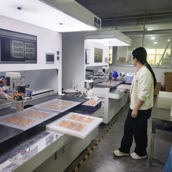 operator inspecting automatic doming production