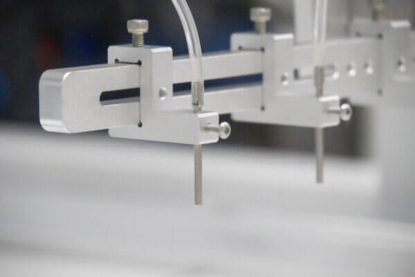 sliding multi head resin dispensing nozzle bracket