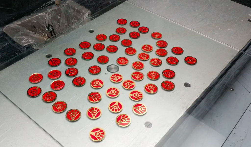 Metal logo badges randomly placed for SJ4060 vision-guided epoxy doming